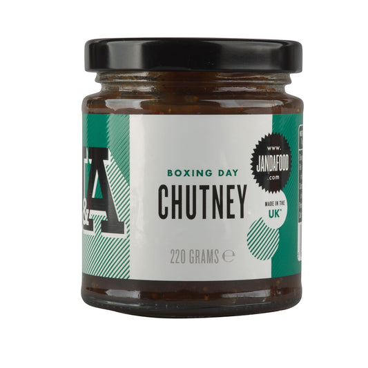 Janda Food Boxing Day Chutney in a glass jar with a black lid, featuring a green and white label.