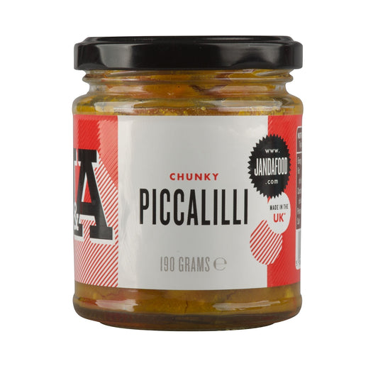 Janda Food Chunky Piccalilli in a glass jar with a black lid, featuring a vibrant vegetable relish label.