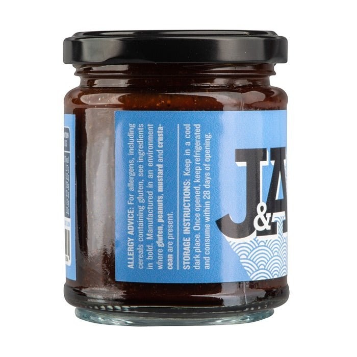 Janda Food soy chilli and garlic sauce in a glass jar with a blue label featuring ingredient and storage information.