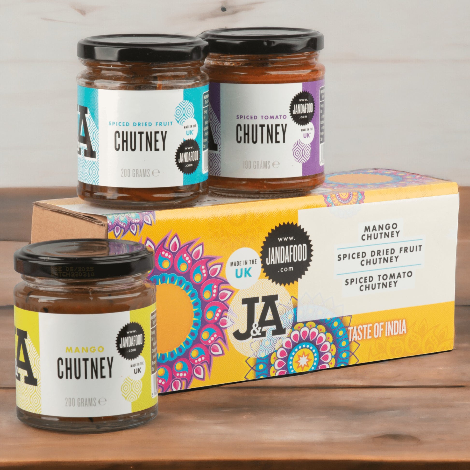 Janda Food Taste of India gift box featuring three jars of handcrafted mango, spiced fruit, and spiced tomato chutney.